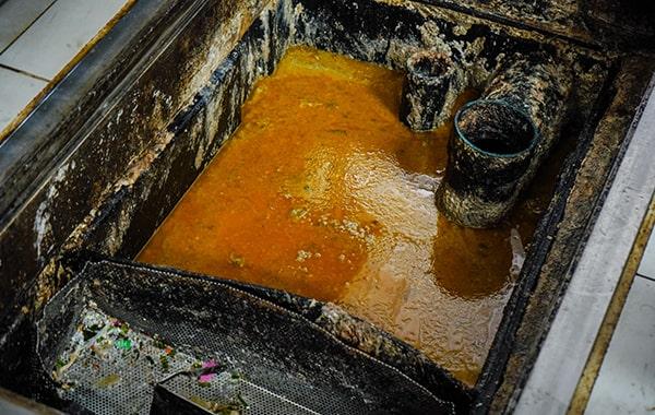 regular grease trap cleaning can help prevent plumbing problems such as clogs and backups